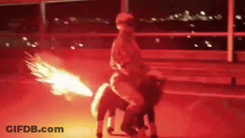 A Person Riding On The Back Of A Horse With A Fire Coming Out Of Its Tail GIF