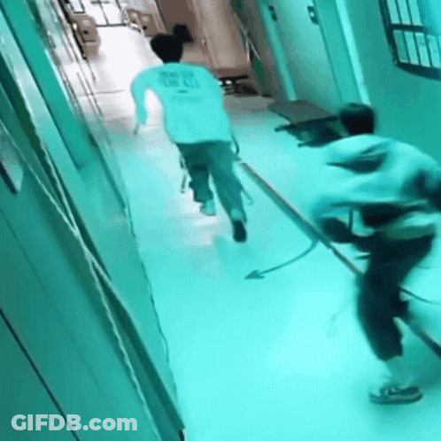 A Person Running Down A Hallway With A Shirt That Says " Never Give Up " On It GIF