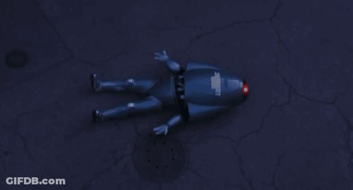 A Person 'S Arm Is Shown In A Dark Room With A Yellow Sign In The Background That Says ' A ' On It GIF