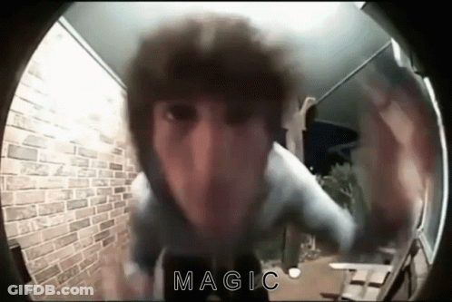 A Person 'S Face Is Visible Through A Doorbell And The Words Magic Are Visible GIF