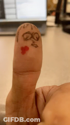 A Person 'S Finger Has A Face Drawn On It With The Letters Qq And A Heart GIF