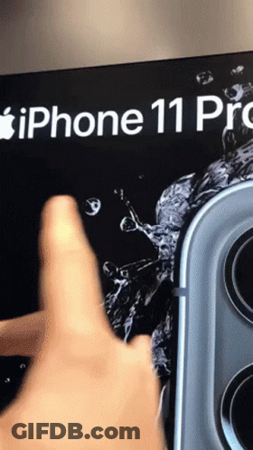 A Person 'S Finger Is Pointing At An Iphone 11 Pro Advertisement GIF