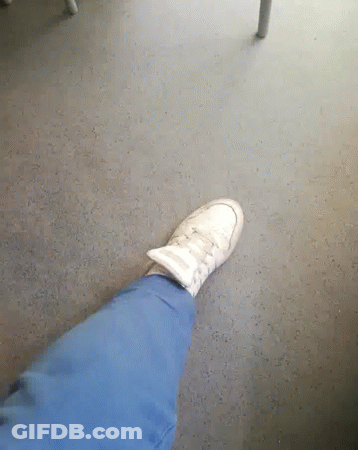 A Person 'S Foot Is Shown With A Pair Of White Shoes On GIF