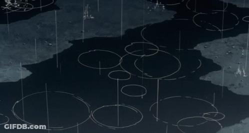 A Person 'S Foot Is Splashing In A Puddle Of Water With A Drawing Of A Heart On The Ground GIF