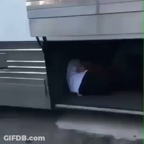 A Person 'S Foot Is Sticking Out Of The Trunk Of A Silver Vehicle GIF