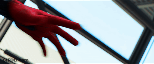 A Person 'S Hand In A Red Glove Reaches Out Towards A Window GIF