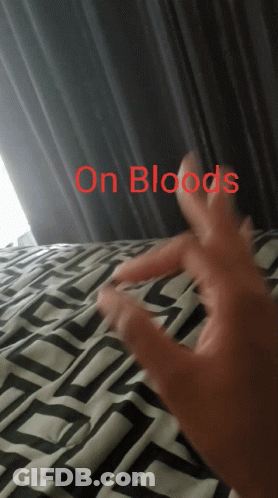 A Person 'S Hand Is Laying On A Bed With The Words " On Bloods " Above It GIF