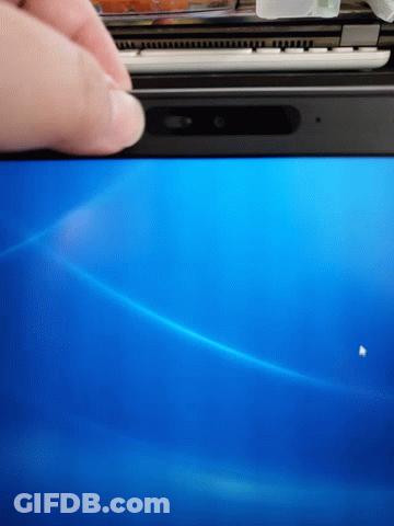 A Person 'S Hand Is Pressing A Button On A Blue Computer Screen GIF