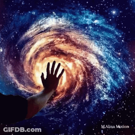 A Person 'S Hand Is Reaching Out Into A Galaxy GIF