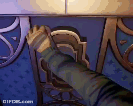 A Person 'S Hand Is Reaching Out To Open A Door In A Video Game . GIF