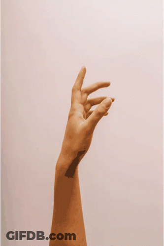 A Person 'S Hand Is Reaching Up In The Air GIF