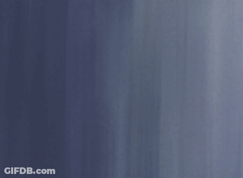 A Person 'S Hand Is Touching A Wall With A Blue Shirt On GIF