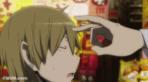 A Person 'S Hand Is Touching Another Person 'S Forehead In Front Of A Sign That Says Mcdonalds GIF