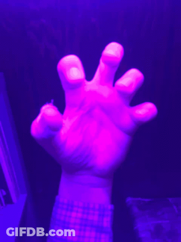 A Person 'S Hand With A Plaid Shirt On Is Reaching Out GIF