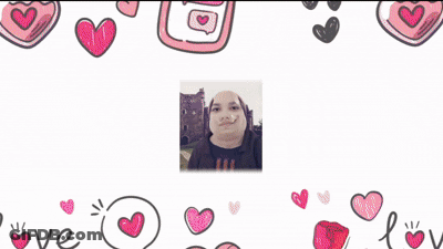 A Person 'S Hands Are Holding A Picture Of A Cat Surrounded By Hearts GIF