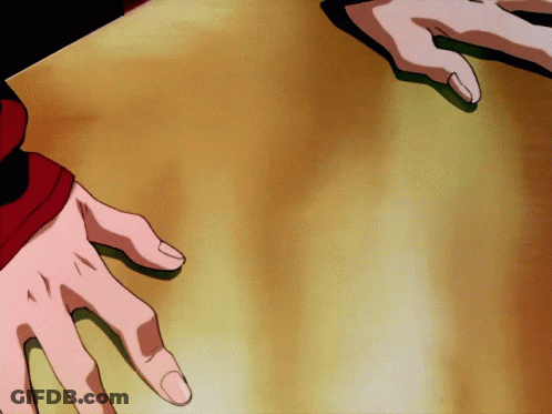 A Person 'S Hands Are Reaching Out Towards Each Other GIF