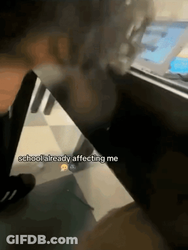 A Person Sitting At A Desk With The Words " School Already Affecting Me " On The Bottom GIF