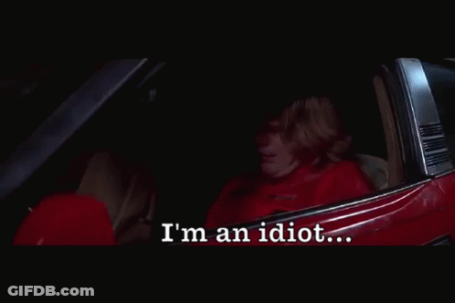 A Person Sitting In A Car With The Words I 'M An Idiot Below Them GIF
