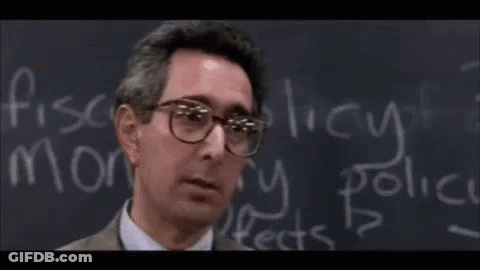 A Person Sitting In A Classroom With The Word Bueller Written On The Screen GIF