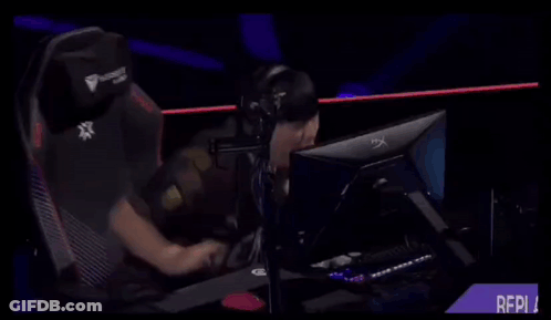 A Person Sitting In Front Of A Computer With A Shirt That Says ' Gen ' On It GIF