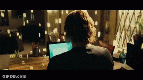A Person Sitting In Front Of A Computer With The Letters C And S Visible On The Screen GIF