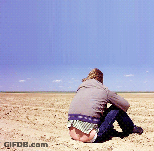A Person Sitting In The Dirt With Their Butt Showing GIF