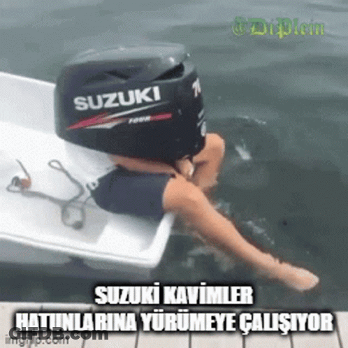 A Person Sitting On A Boat With A Suzuki Outboard Motor On Top Of Them GIF