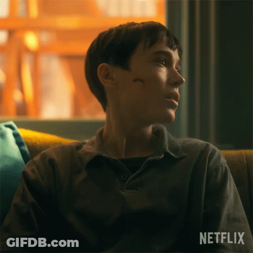 A Person Sitting On A Couch With A Netflix Logo On The Bottom Right GIF