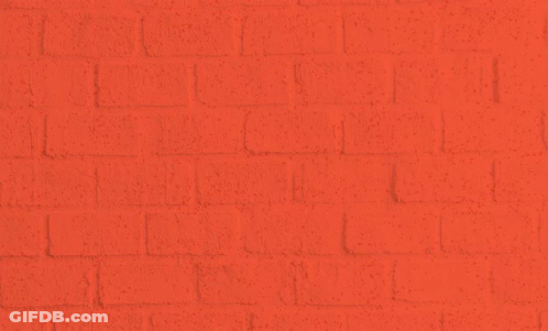 A Person Spray Paints The Words " We Can 'T Breathe " On A Brick Wall GIF