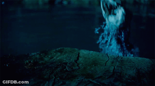 A Person Standing In A Body Of Water With A Blue Background GIF