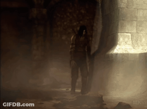 A Person Standing In A Dark Room With The Word Mk On The Bottom Left GIF