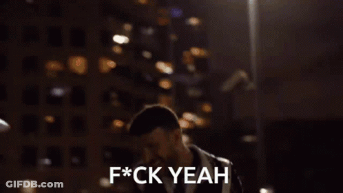 A Person Standing In Front Of A Building That Says F * Ck Yeah On It GIF