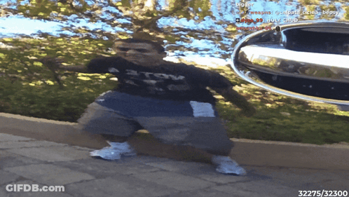 A Person Standing In Front Of A Car With The Number 32375 On The Bottom Right GIF