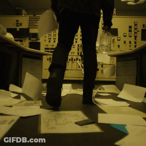 A Person Standing In Front Of A Control Panel That Has A Clock On It That Says ' Clock ' On It GIF