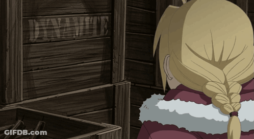 A Person Standing In Front Of A Wooden Crate That Says Dynamite GIF
