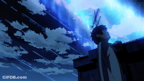 A Person Standing On A Roof Looking Up At A Starry Sky GIF