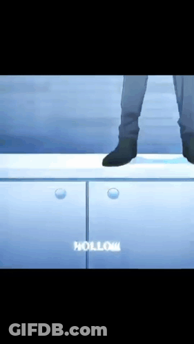 A Person Standing On Top Of A Cabinet With The Word Hollow In White GIF