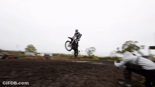 A Person Taking A Picture Of A Person On A Motorcycle GIF