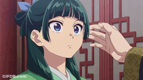 A Person Touches A Girl 'S Face With Their Hand GIF