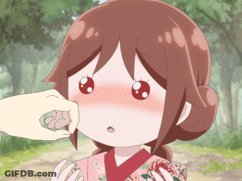 A Person Touching A Girl 'S Face With A Pink Kimono On GIF