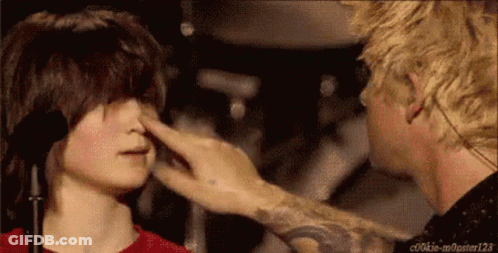 A Person Touching Another Person 'S Nose With A Tattoo On Their Arm That Says Cookie-Monster123 GIF