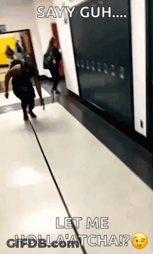 A Person Walking Down A Hallway With The Caption Sayy Guh Let Me Holla Atcha ? GIF