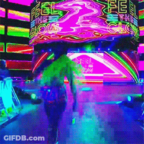 A Person Walking In Front Of A Neon Sign That Says " Feel The Glow " GIF
