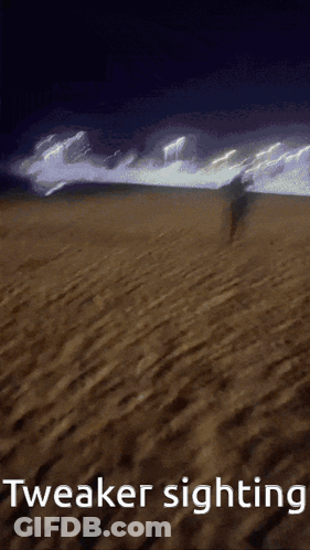 A Person Walking On A Beach With The Words Tweaker Sighting GIF