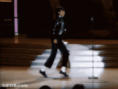 Person Walking On Stage With Microphone GIF