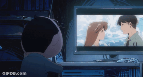 A Person Watching A Cartoon On A Computer Monitor GIF