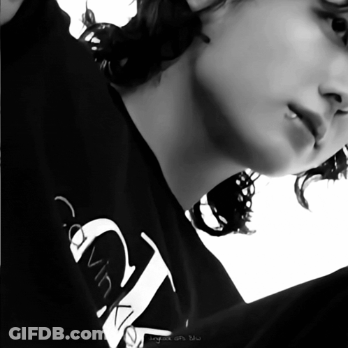 A Person Wearing A Black Calvin Klein Shirt GIF