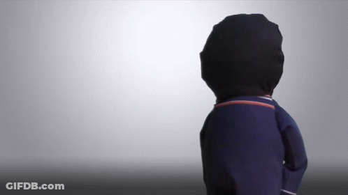 A Person Wearing A Black Hat And A Blue Sweater GIF