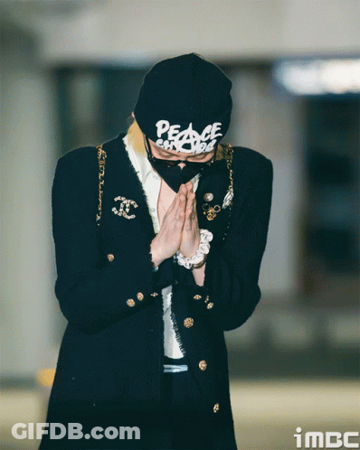 A Person Wearing A Black Hat That Says Peace GIF