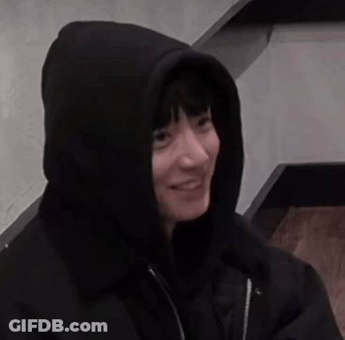 A Person Wearing A Black Hoodie With A Hood On Their Head GIF